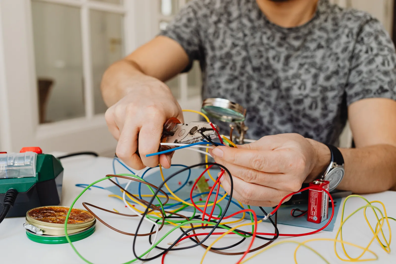 Stripping and sorting conductors at the bench, for electrician in Edmonton