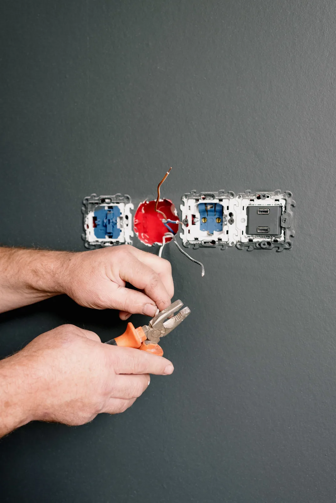 Wiring an outlet box into a finished wall, for code violation in Edmonton