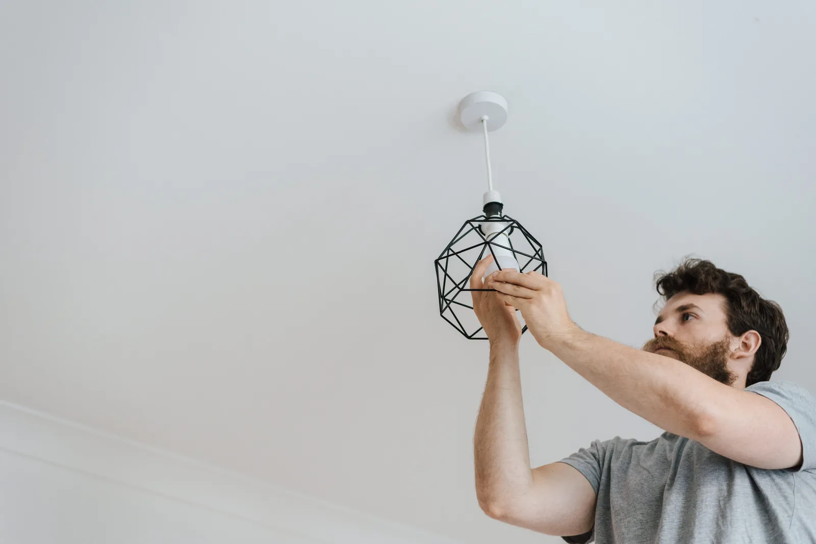 Fitting a lamp into a pendant fixture, for ceiling fan installation in Edmonton