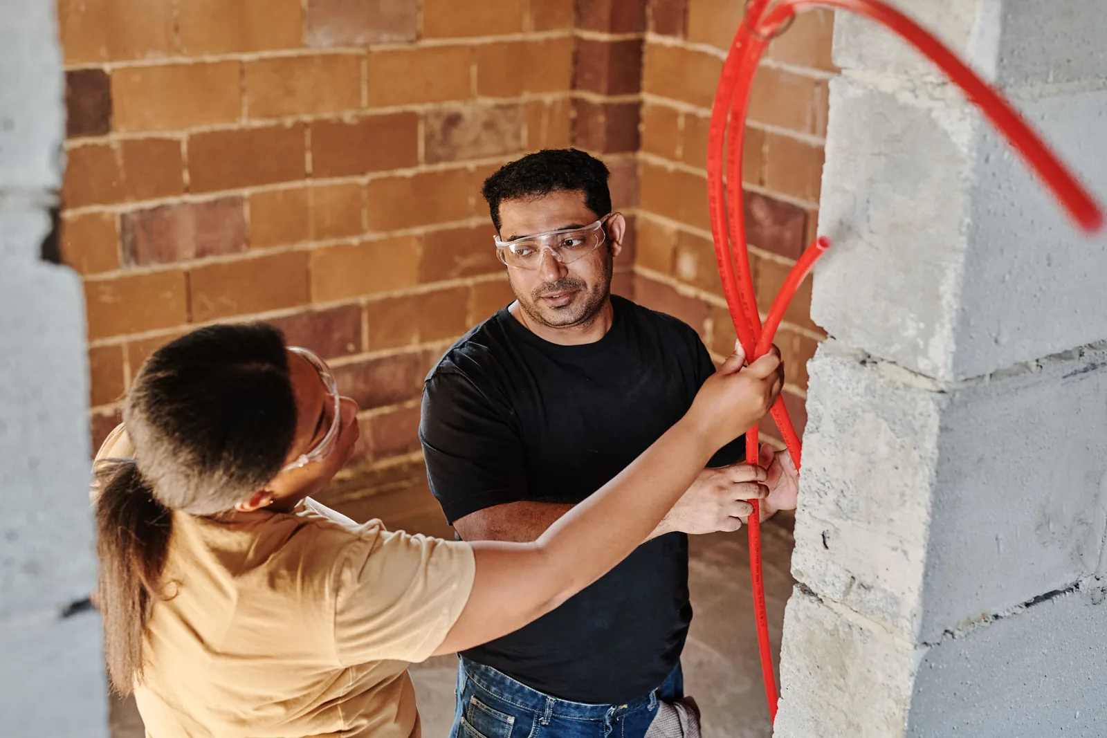 Running conduit across a block wall, for property management electrical in Edmonton